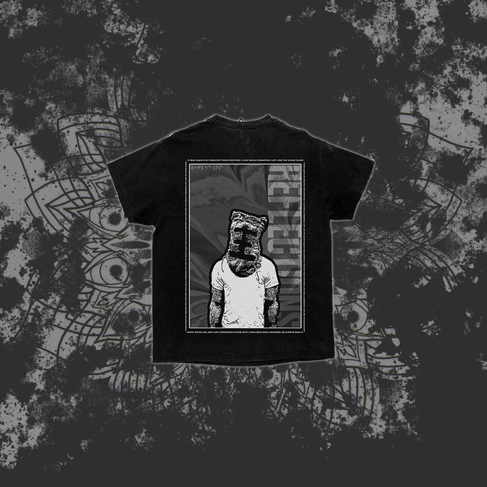 A black Reflections T-shirt features an illustration of a person in a tank top with a paper bag on their head, framed by a rectangle with "RECLUZE" vertically on the right, set against a dark, abstract background.
