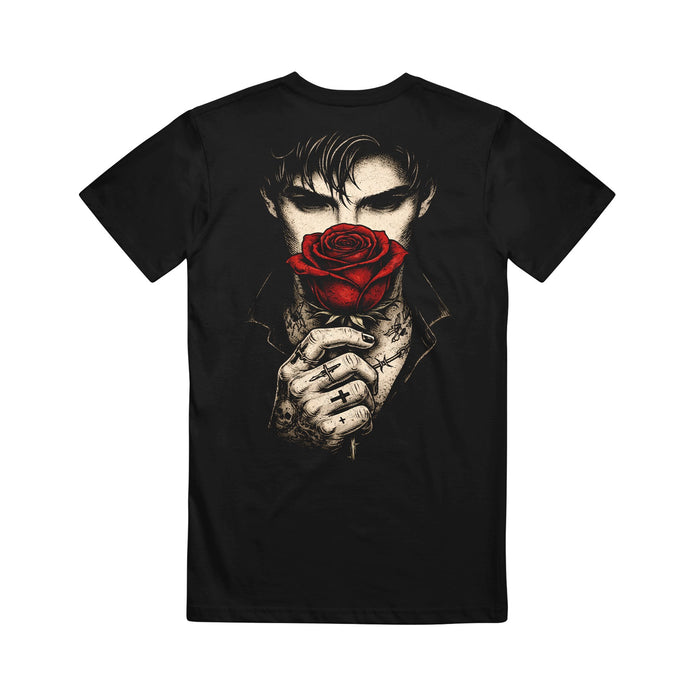 Melrose Avenue black t-shirt featuring a tattooed person holding a red rose in front of their face, with intense eyes and dark hair—ideal for anyone looking for a unique rose-themed design.