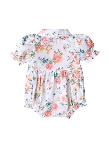 The Ivy City Co Baby Sophia Romper in Countryside Peony Blossom features a floral cotton design with short puffed sleeves, gathered details, and elastic leg openings—perfect for spring and summer outings.