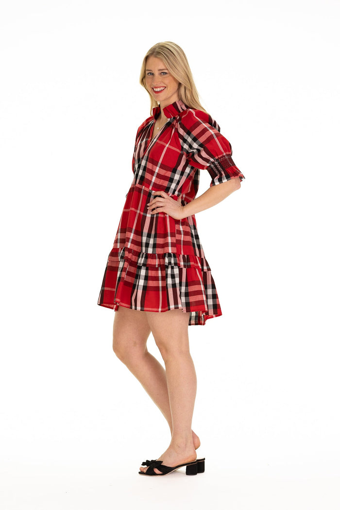 Side view of model in red plaid tartan puff sleeve dress