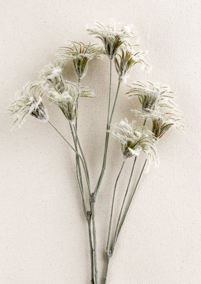 A faux clematis fuzzy bud spray.