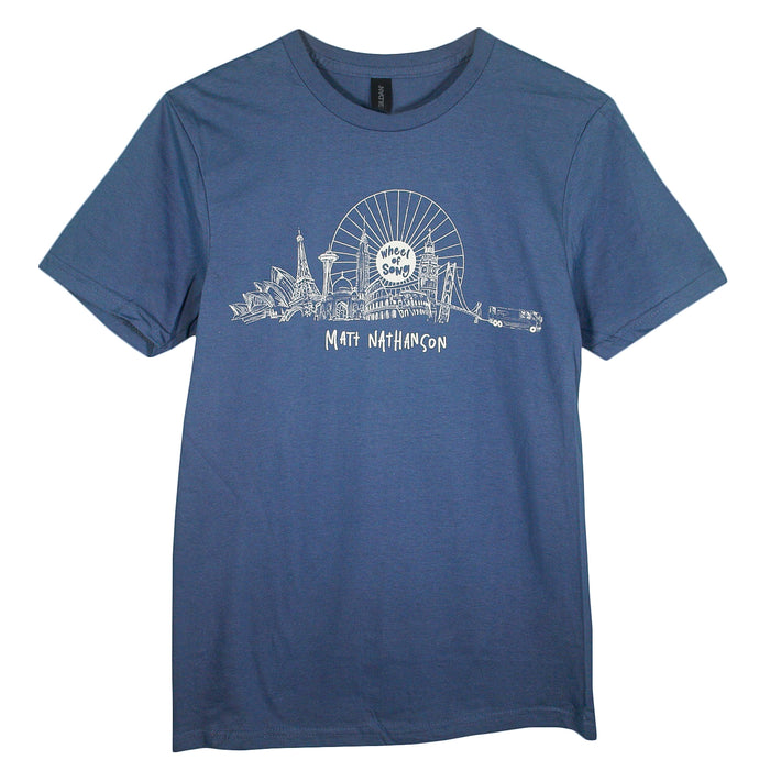 The Matt Nathanson blue Gildan Softstyle T-Shirt features a white city landmark and Ferris wheel design with “Matt Nathanson” below. Made from ring-spun cotton for a modern classic fit and lasting comfort.