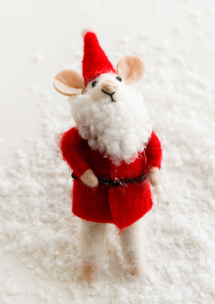 A felted mouse ornament dressed up as Santa.