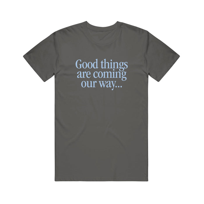 A dark gray Rival Schools cotton T-shirt featuring "Good things are coming our way..." printed in light blue text on the front.