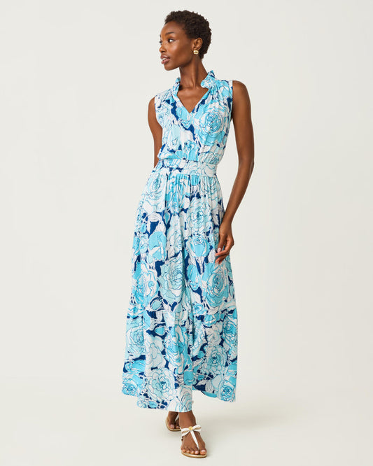 Woman wearing a blue floral dress on a white background
