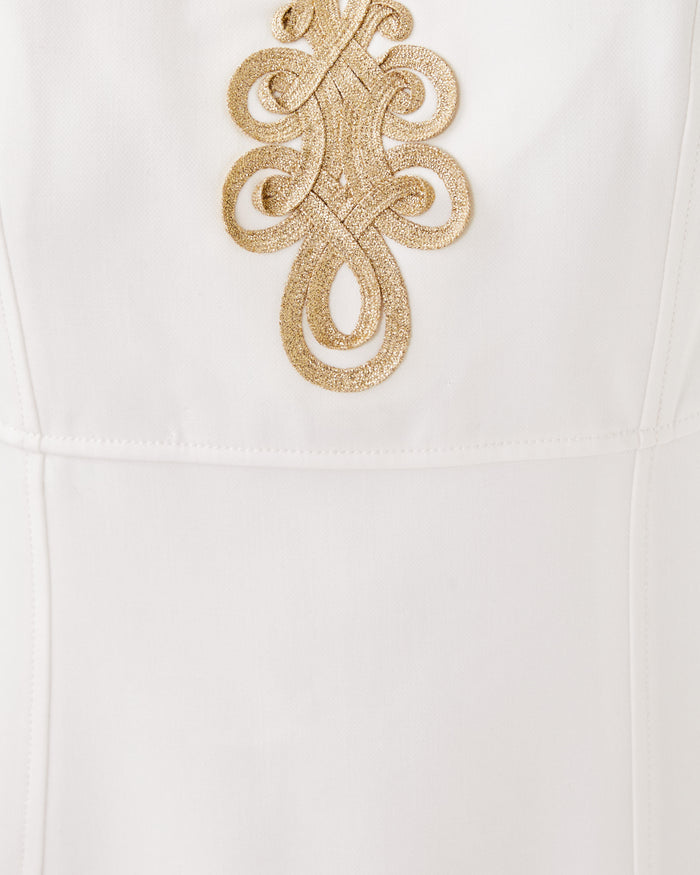 Up close view of gold neckline detailing  the Lilly Pulitzer Trini Viscose Shift Dress. A white sleeveless dress with gold detailing around collar.