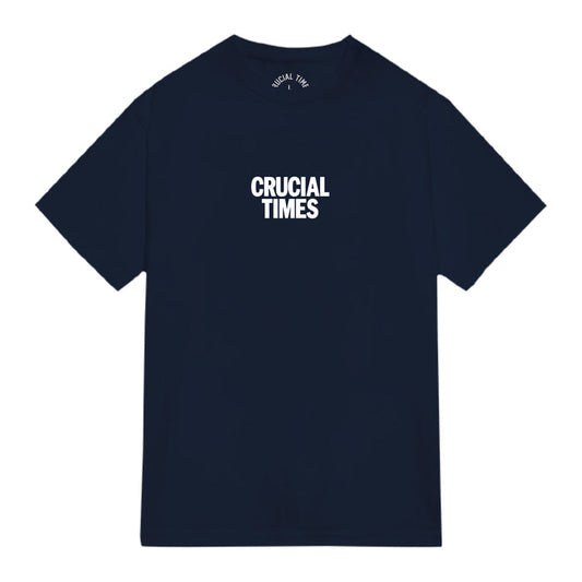 A plain navy blue Crucial Times t-shirt featuring "CRUCIAL TIMES" boldly printed in white across the chest—ideal for fans of quality printed apparel.