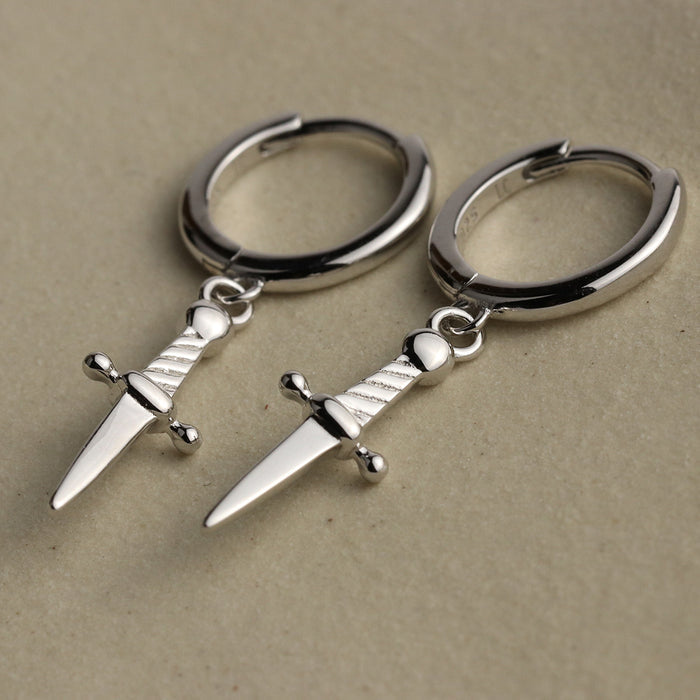Mini daggers hoop earrings in sterling silver with a snap close.