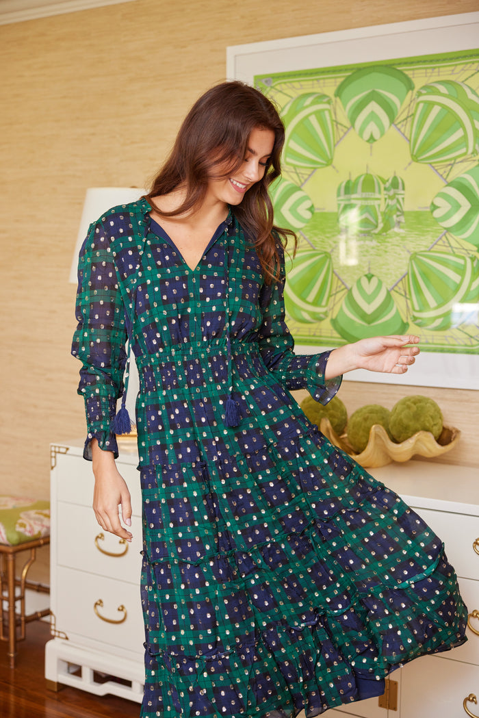 Playful model in the Sail to Sable Smocked Waist Midi Dress - Blackwatch Plaid