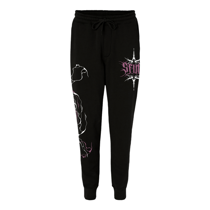 SFINX black sweatpants with a drawstring waist, white abstract line art on the right leg, and a purple SFINX graphic with text on the left hip, shown against a plain white background.