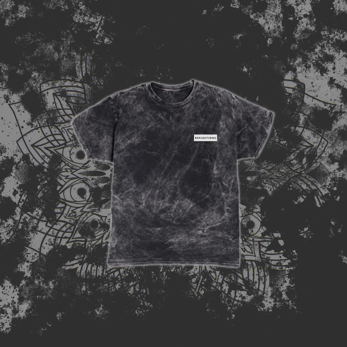 A black marble-pattern T-shirt from Reflections with a small white rectangular label reading RESURRECTION on the left chest, displayed against a grey abstract geometric background.